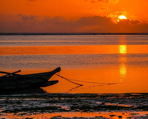 Sunset in Zanzibar, Indian Ocean with local fishing boat