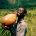 A man from Congo drinks water from a traditional calabash