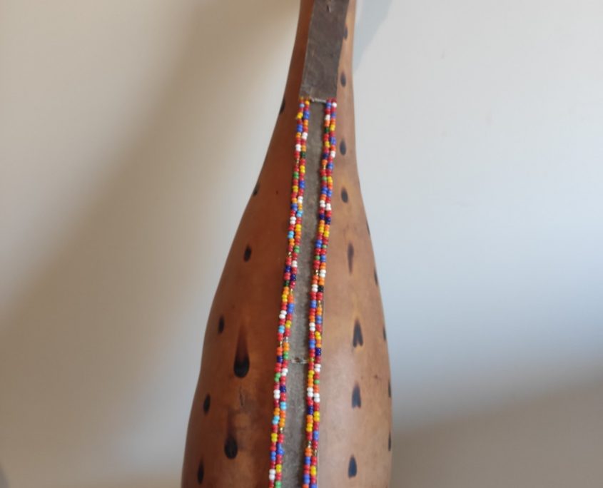 An elaborately decorated and adorned calabash from Tanzania