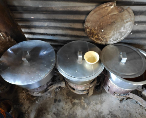 Cooking on coal stoves with big cookware