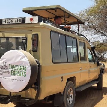Tanzania Experts Guest on tour with an extended Safari truck and elevating roof